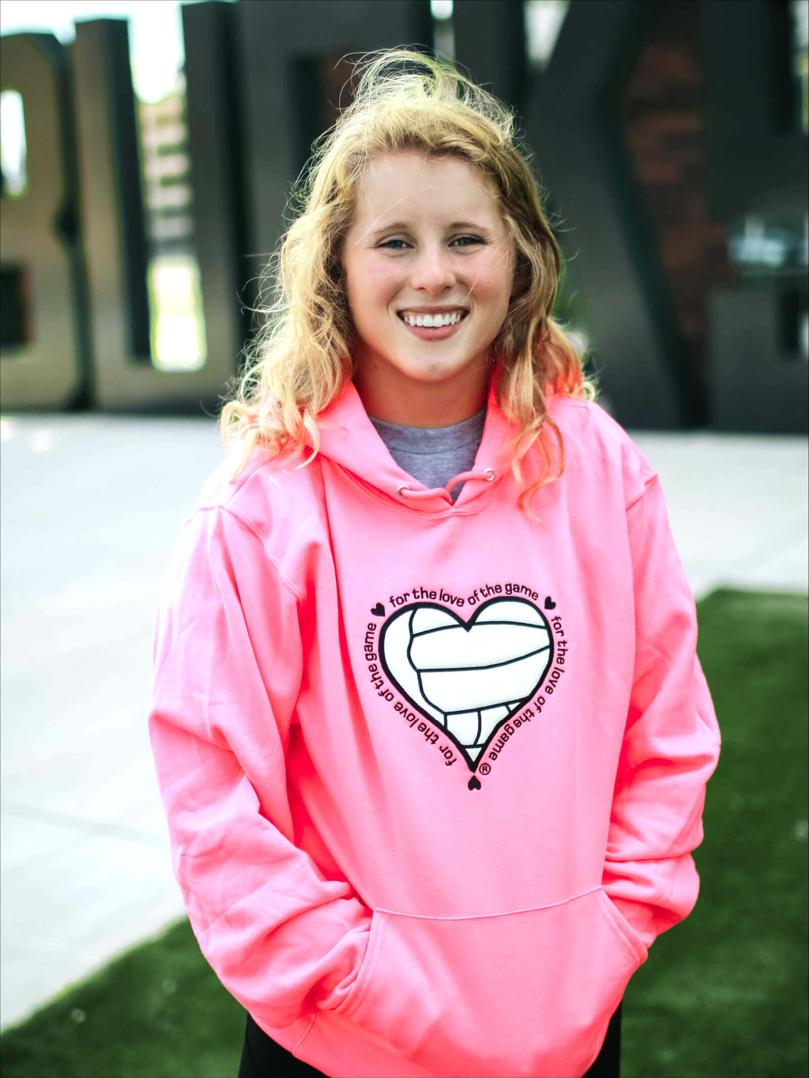 For the Love of the Game with Volleyball detail on Neon Pink hoodie